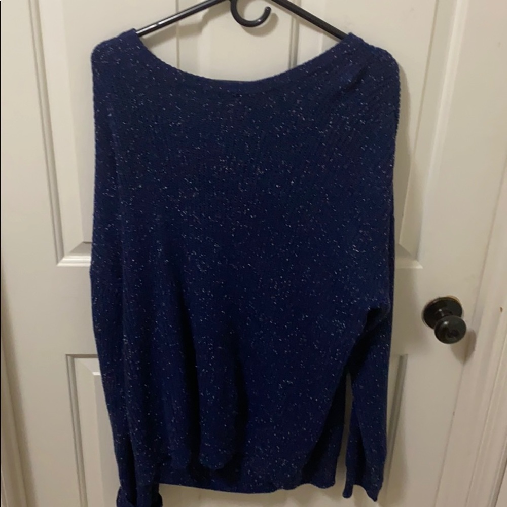 A low hanging v neck sweater
